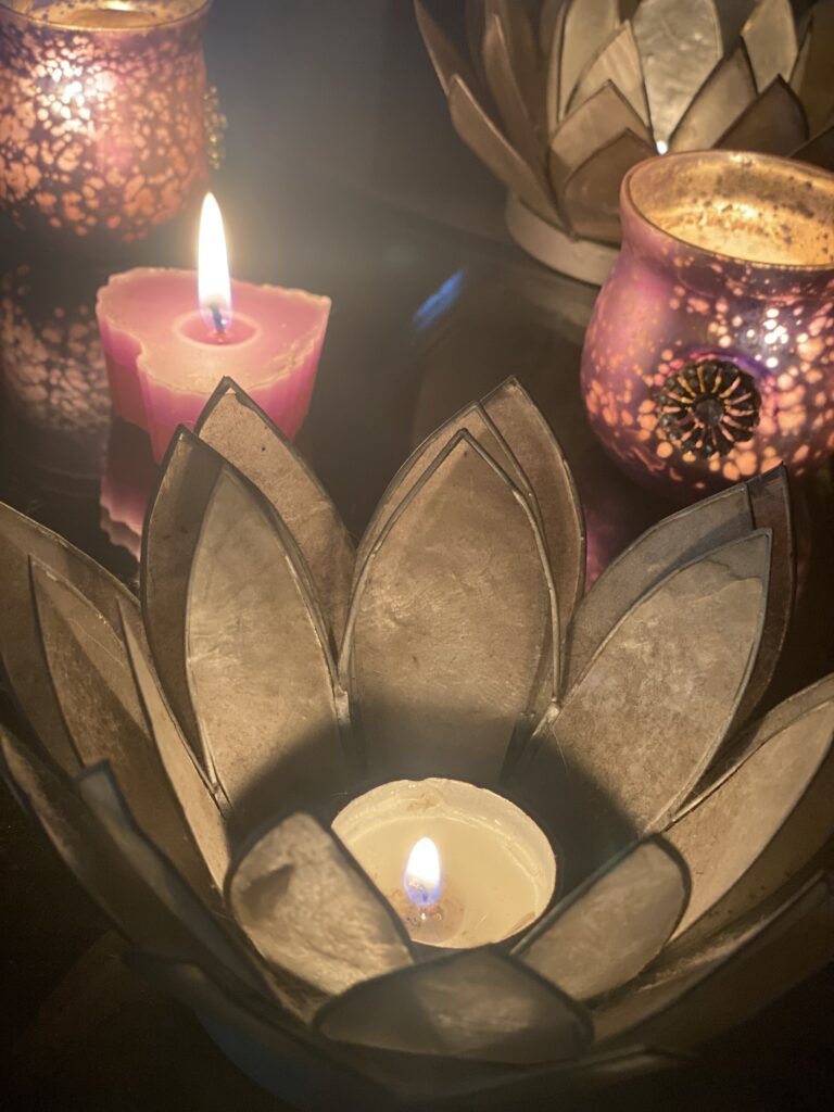 A close up of lit candles for naming angel babies