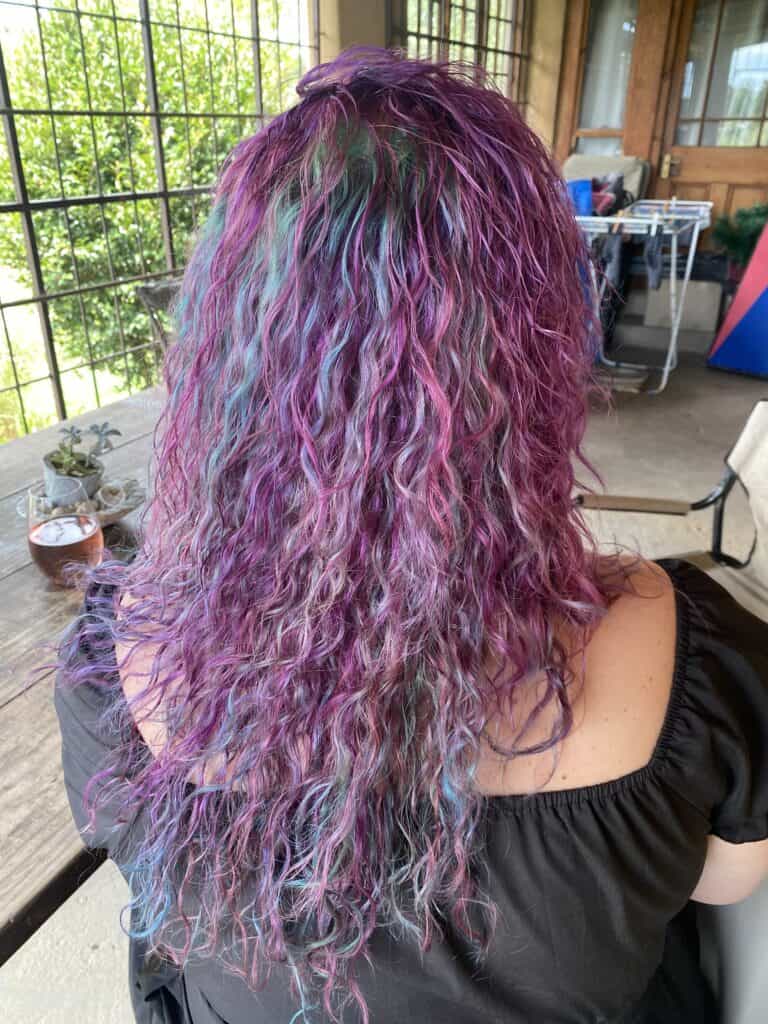 Bianca Johnson with pink and purple hair, present day